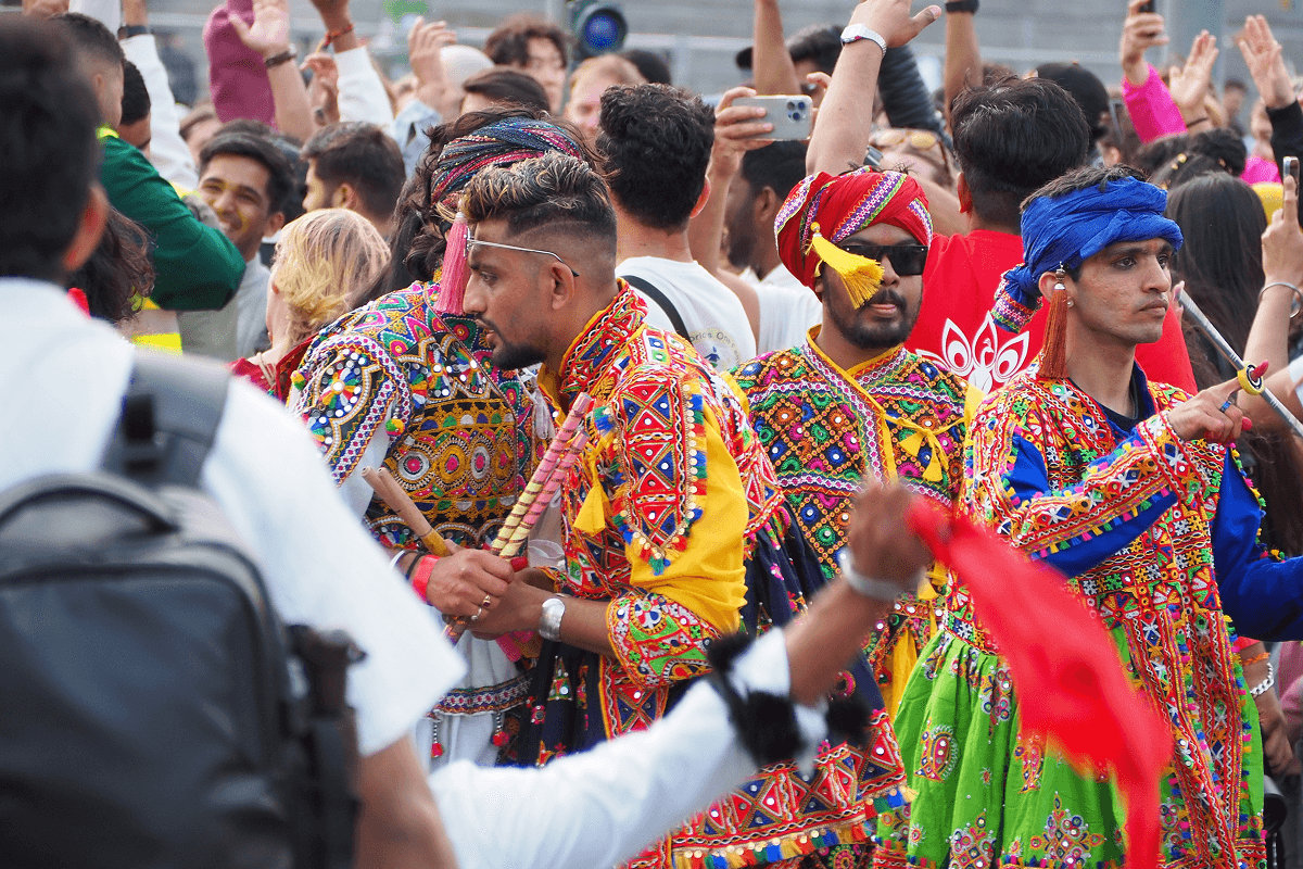 People celebrating in colorful traditional outfits