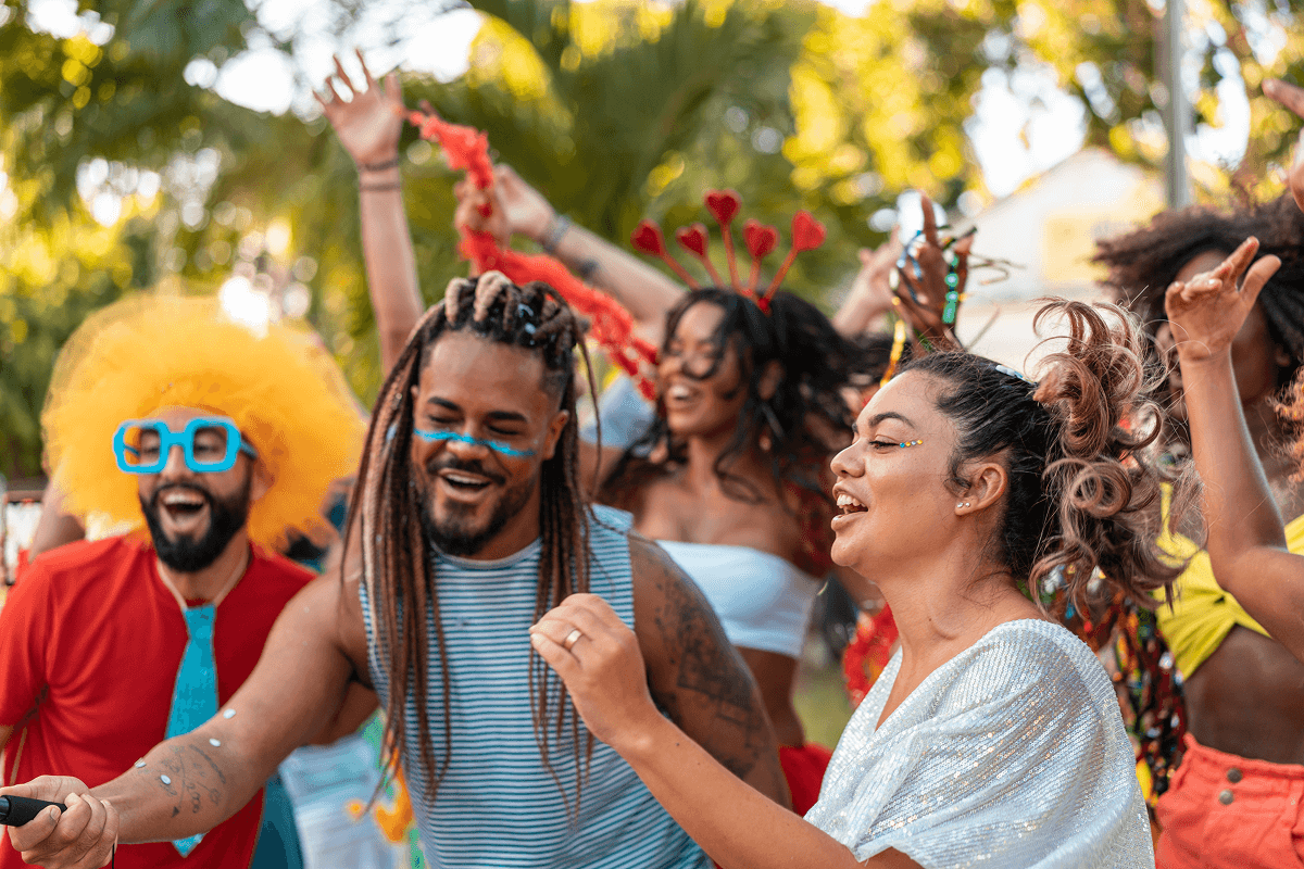 People dancing at a festive outdoor party