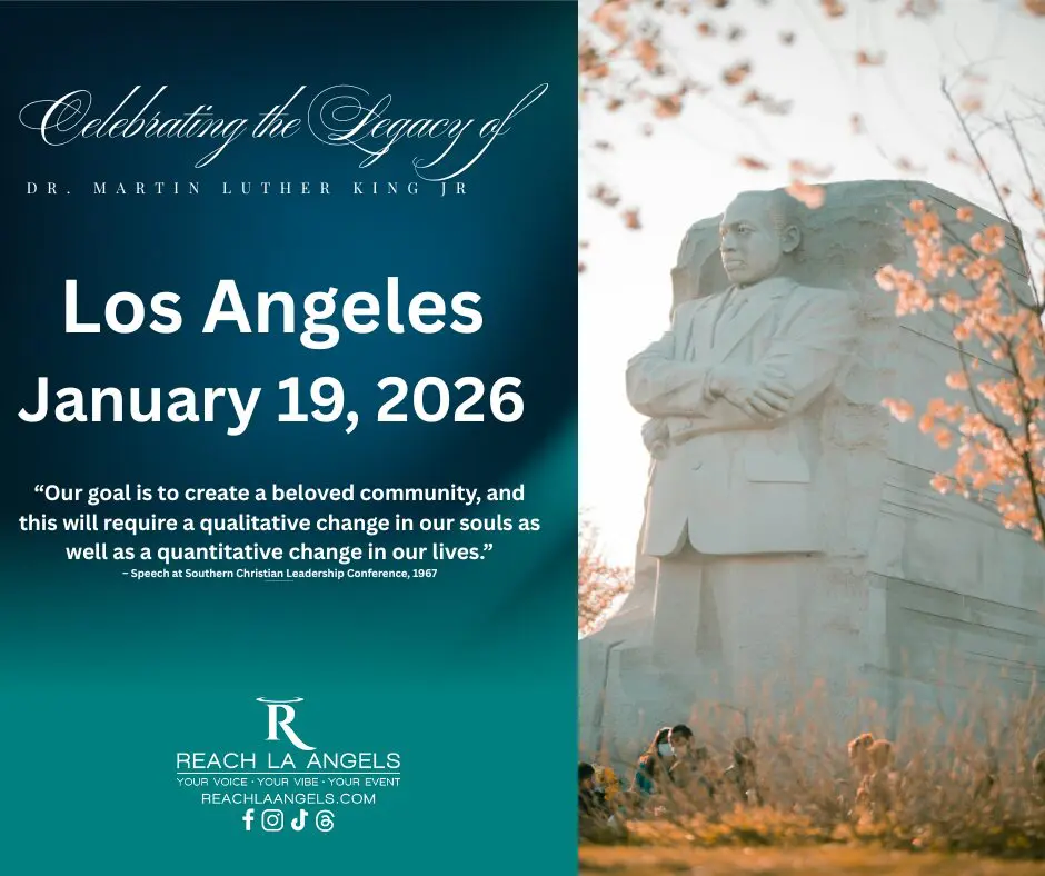 Stone memorial statue beside teal event poster