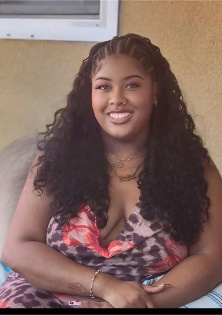 Smiling woman with long curly hair
