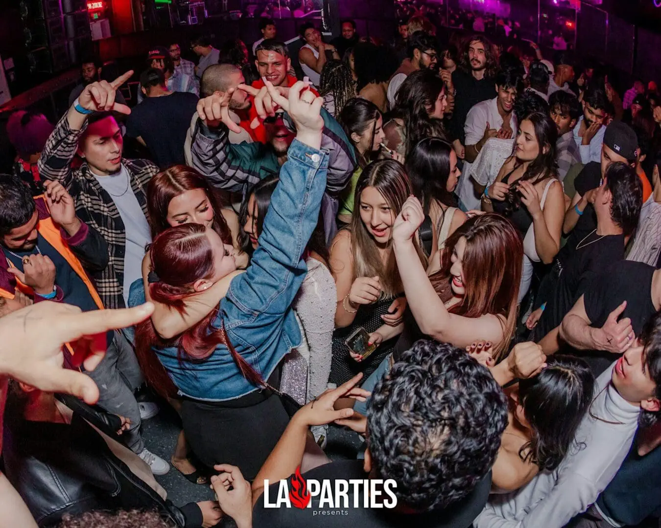 Crowded nightclub dance floor with people dancing